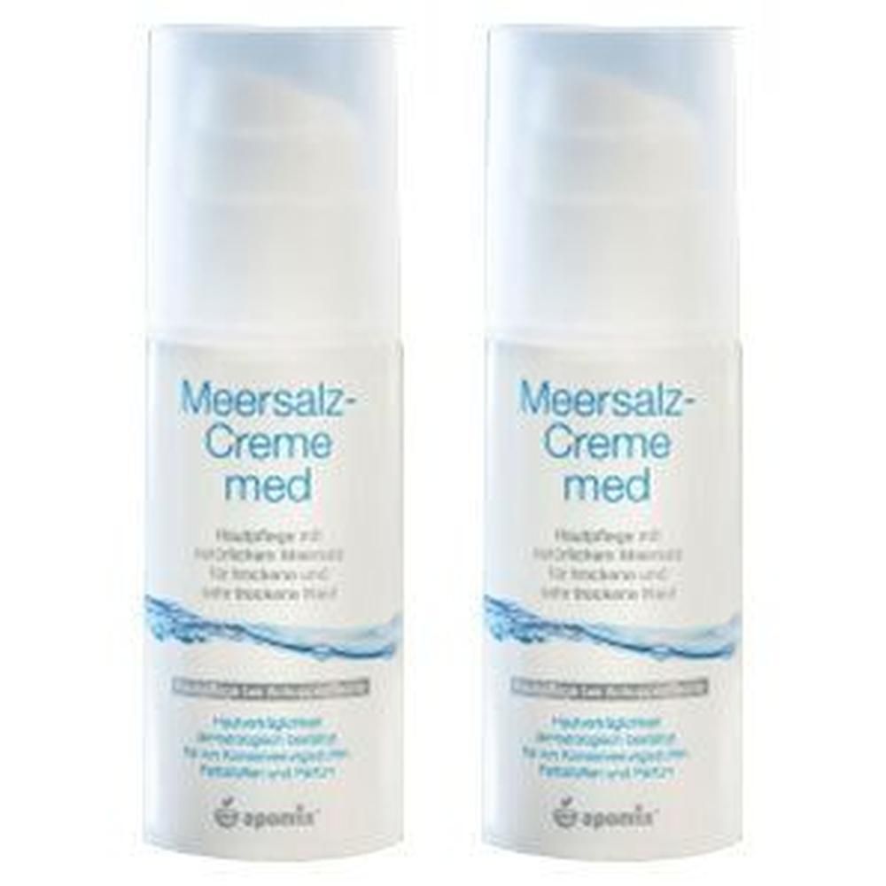 Zwei weiße Spenderflaschen mit Aufschrift "Meersalz-Creme med". Blaue und weiße Wellenmuster. Text in deutscher Sprache.