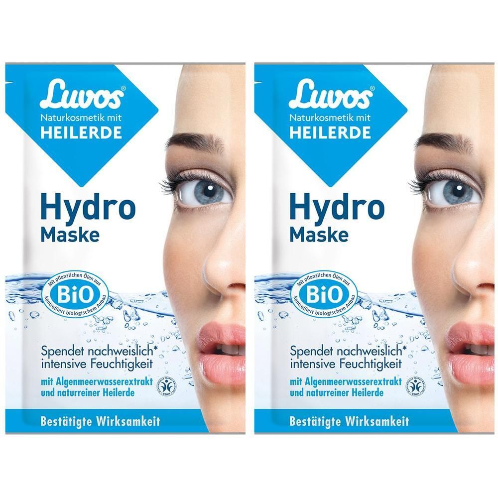 Zwei Beutel Luvos Hydro Maske. Blaue Verpackung mit Produktnamen und Logo. Bio-Siegel. Teilansicht eines Gesichts.