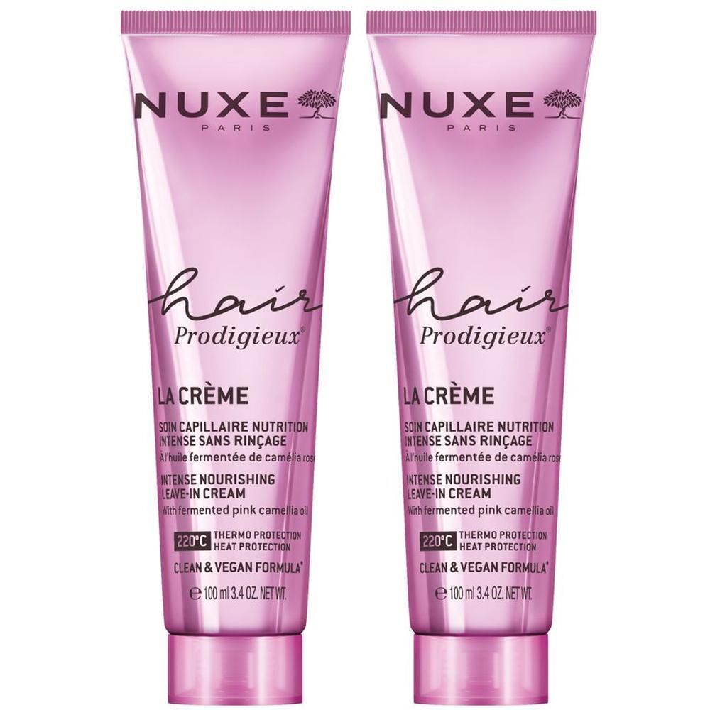 Zwei rosa Tuben. Aufschrift: NUXE, Hair Prodigieux, LA CRÈME, Leave-in Creme. Mit Inhaltsstoffen aus fermentiertem rosa Kamelienöl.