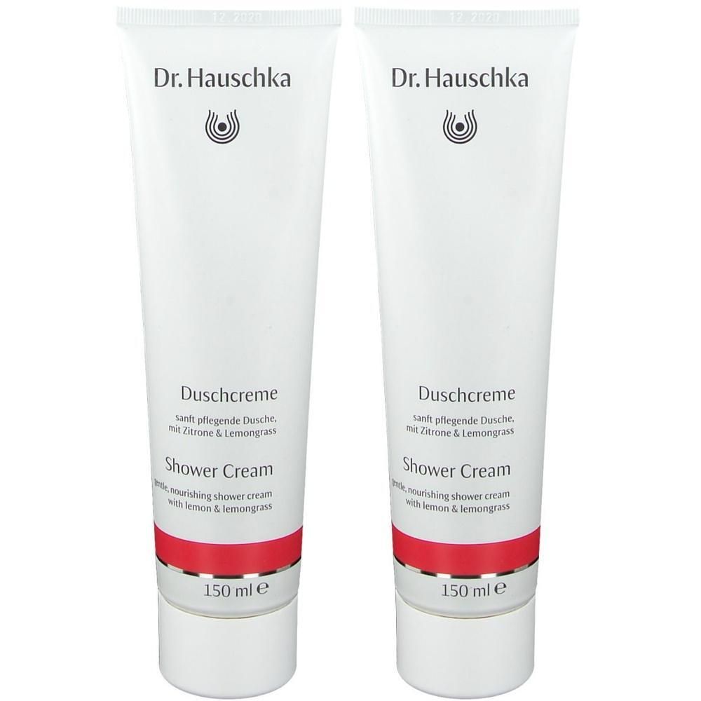 Zwei weiße Tuben Duschcreme mit rotem Streifen. Aufschrift: Dr. Hauschka, Duschcreme, Shower Cream, 150 ml.