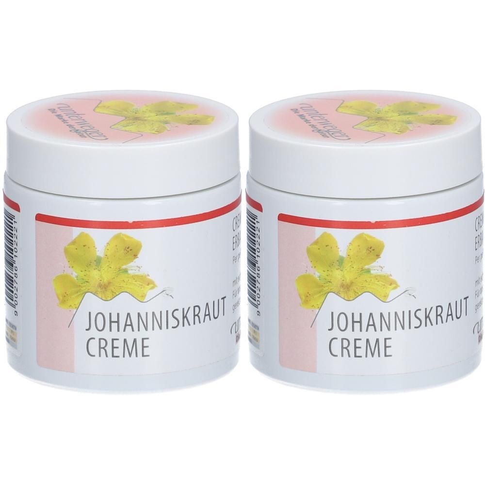 Zwei weiße Tiegel mit rotem Streifen und Aufschrift JOHANNISKRAUT CREME. Aufdruck mit gelber Blume. Deckel mit Aufdruck.