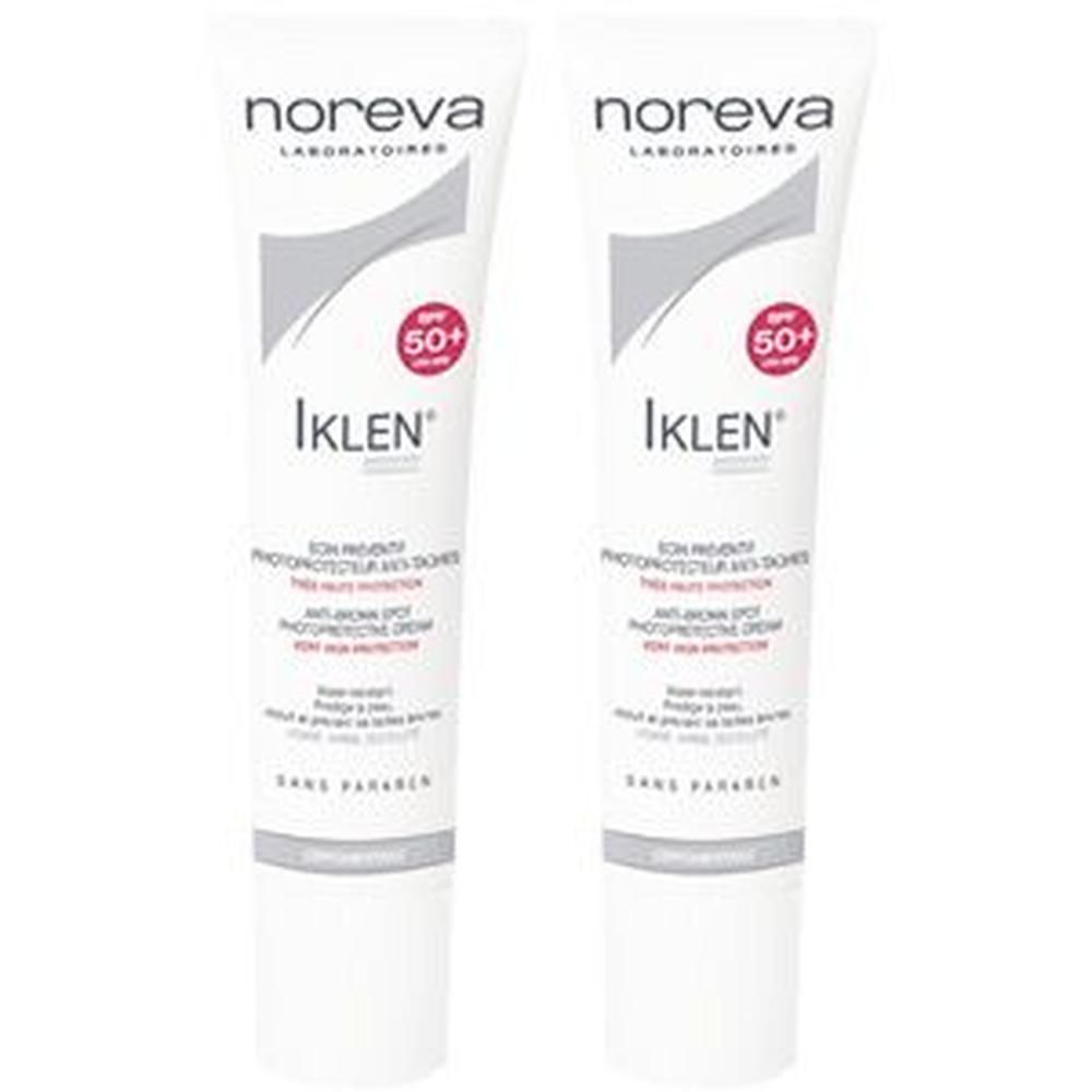 Zwei Tuben Sonnenschutzcreme. Weiße Tuben mit Aufschrift "NOREVA", "Iklen", "SPF 50+" und weiteren Texten. Graue und rote Akzente.
