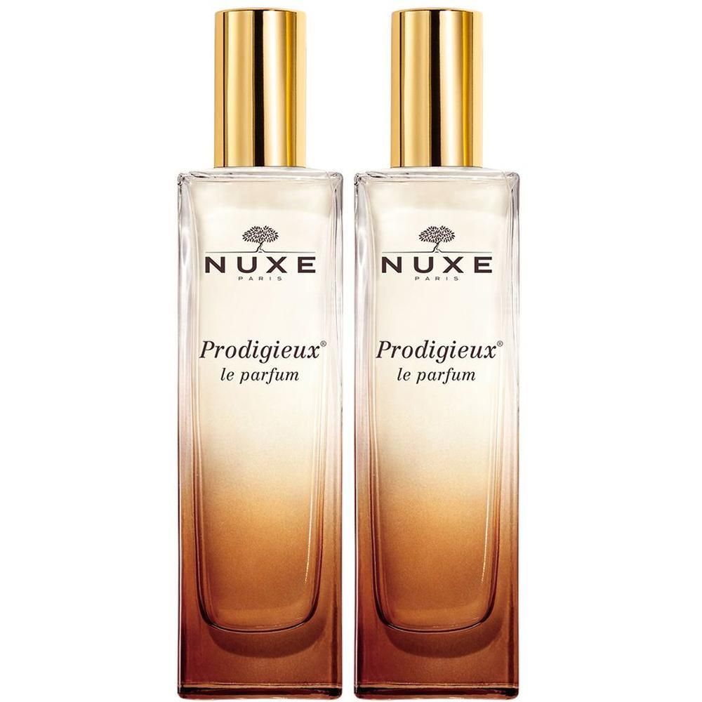 Zwei rechteckige Glasflakons mit goldenen Kappen. Aufschrift: NUXE Paris, Prodigieux le parfum.
