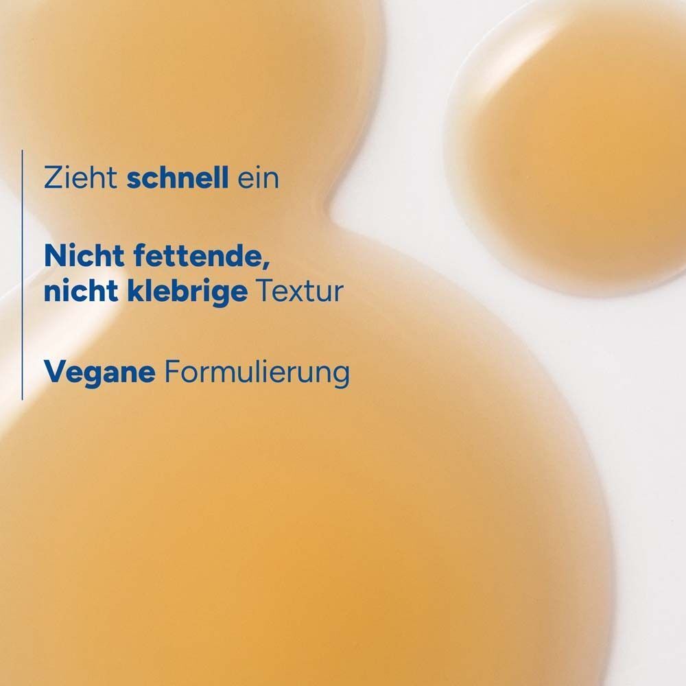 Flüssigkeitstropfen. Text: Zieht schnell ein. Nicht fettende, nicht klebrige Textur. Vegane Formulierung.