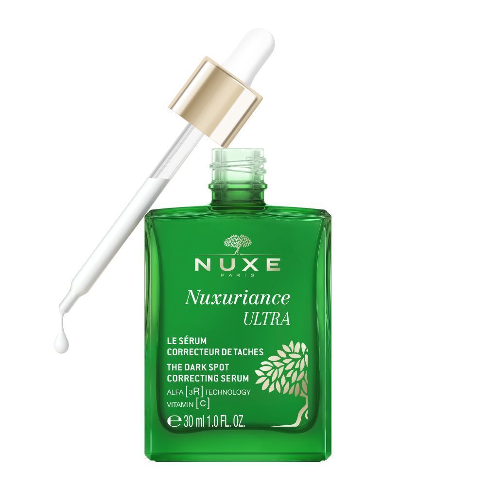 Grüne Serumflasche mit weißer Pipette. Aufschrift: NUXE Nuxuriance Ultra, Le Sérum Correcteur de Taches, 30 ml. Pipette geöffnet.