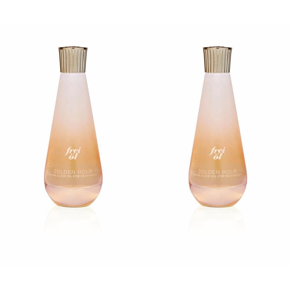 Zwei Flaschen frei öl® ULTRA GLOW ÖL Golden Hour. Tropfenförmige Flaschen mit goldfarbenen Verschlüssen und Etiketten.