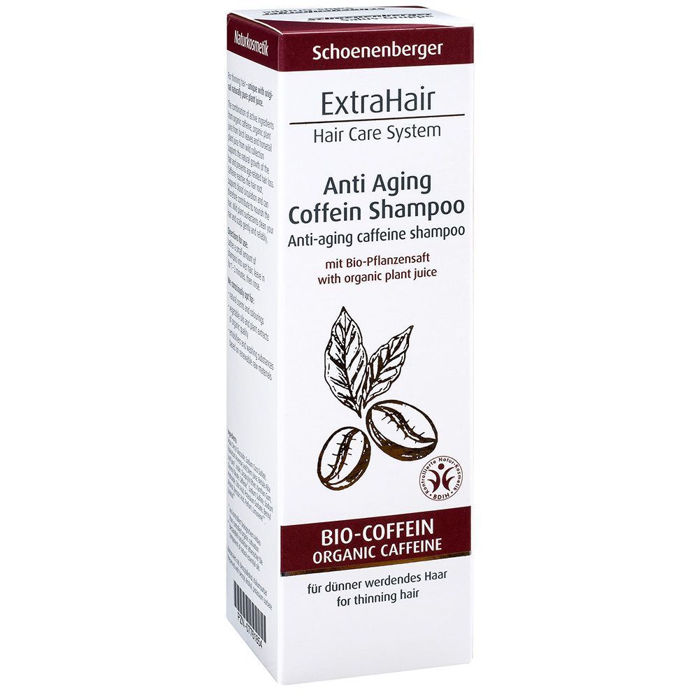 Schräg stehende Shampoo-Verpackung. Aufdruck: ExtraHair Anti Aging Coffein Shampoo, Bio-Coffein, für dünner werdendes Haar. Mit Logo und Illustration.