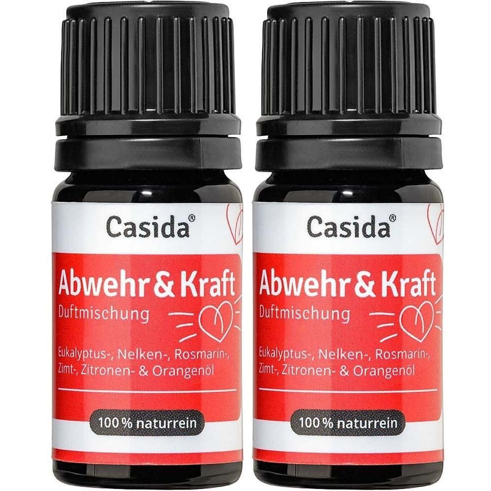 Zwei Flaschen ABWEHR & KRAFT Duftmischung. Schwarze Kappen, rote Etiketten mit Text. 100% naturrein.