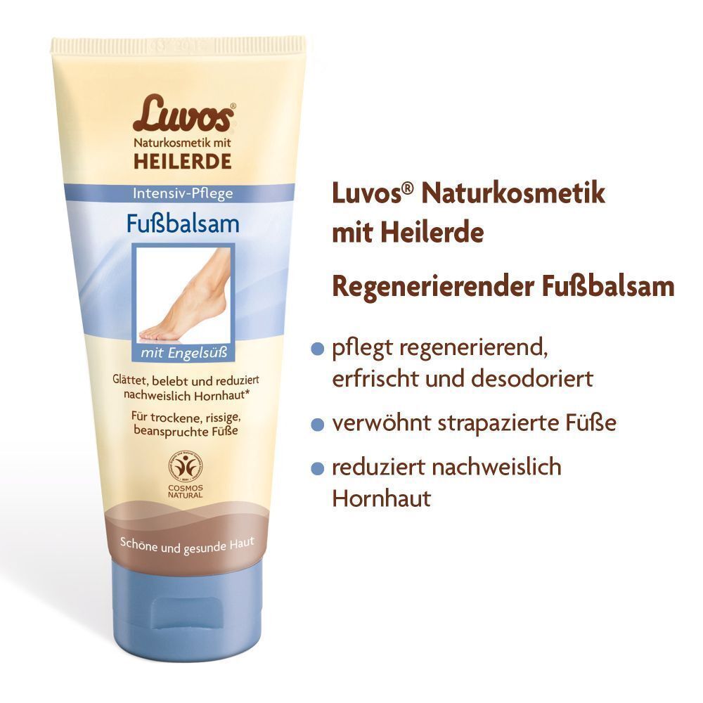 Luvos Heilerde Fußbalsam. Beige Tube mit blauem Deckel. Text: Intensiv-Pflege, Fußbalsam, mit Engelsüß. COSMOS NATURAL.