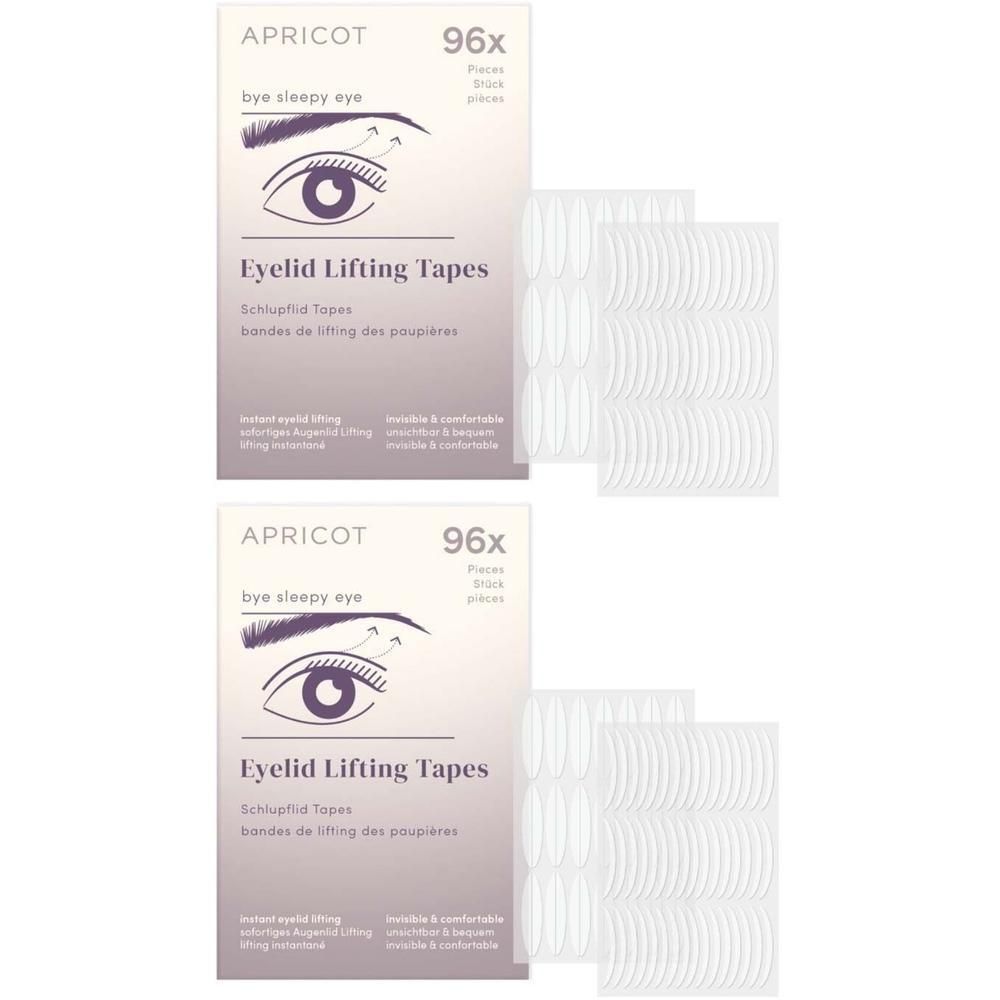 Zwei Packungen APRICOT Eyelid Lifting Tapes. Jede Packung enthält 96 Stück. Weiße Tapes und Verpackung mit Augen-Illustration.