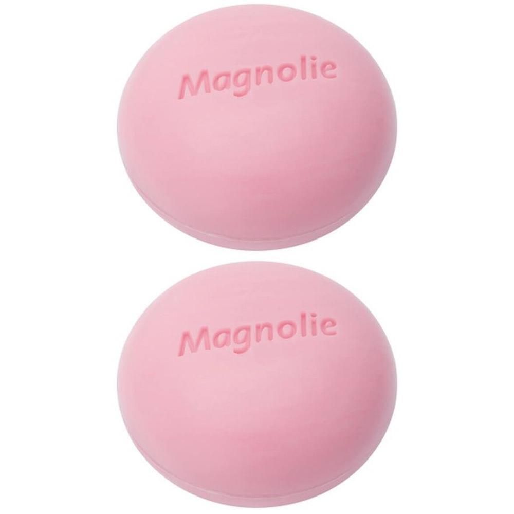 Zwei rosa Kugeln mit der Aufschrift "Magnolie". Die Kugeln sind rund und liegen übereinander.