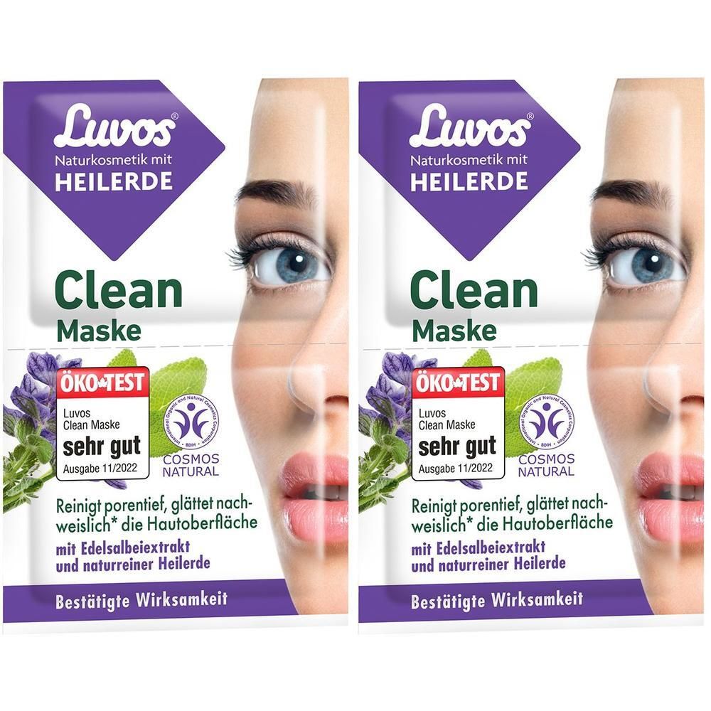 Zwei Packungen LUVOS Clean-Maske. Lila Verpackung mit Logo und Text. ÖKO-TEST Siegel. Teilansicht eines Gesichts.