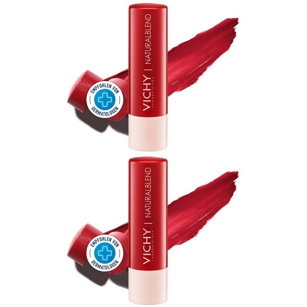 Zwei rote Lippenbalsam-Stifte mit weißem Boden. Aufschrift: VICHY Naturalblend. Daneben ein roter Lippenstift-Abstrich. Siegel: Empfohlen von Dermatologen.