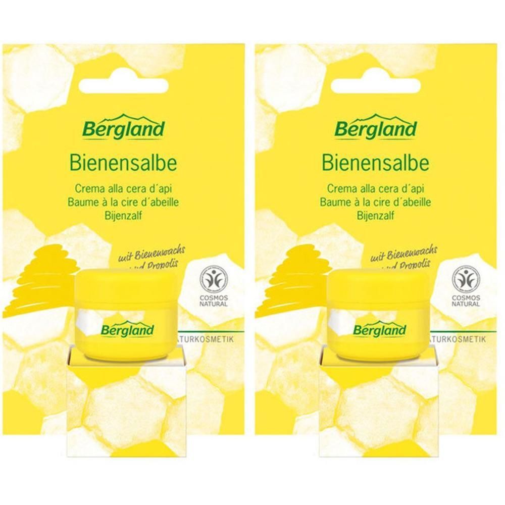 Zwei gelbe Tiegel Bienensalbe mit Verpackung. Aufschrift: Bergland Bienensalbe, COSMOS NATURAL.