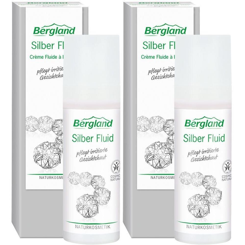 Zwei Flaschen und Verpackungen. Aufschrift: Bergland Silber Fluid. Weiße Flaschen mit silbernen und grünen Elementen. Naturkosmetik.