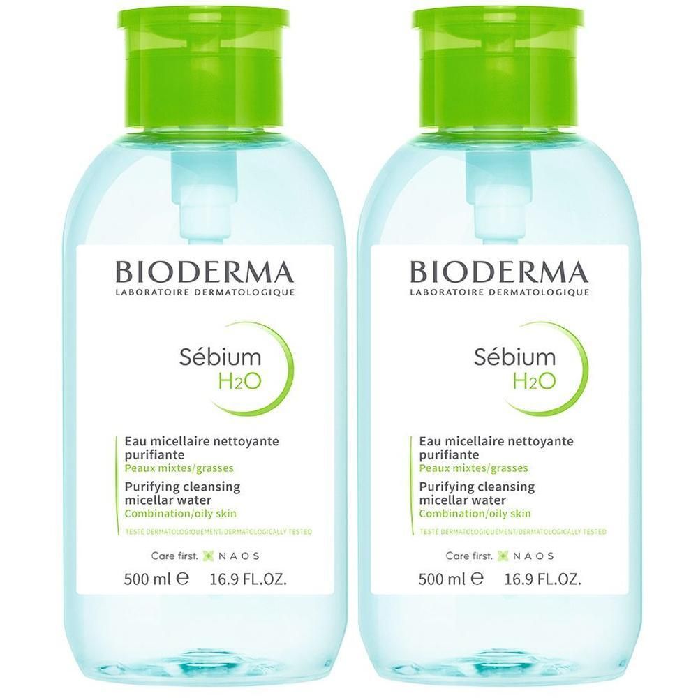 Zwei Flaschen BIODERMA Sebium H2O. Klare Flüssigkeit, grüne Deckel und Etiketten. Pumpverschluss.
