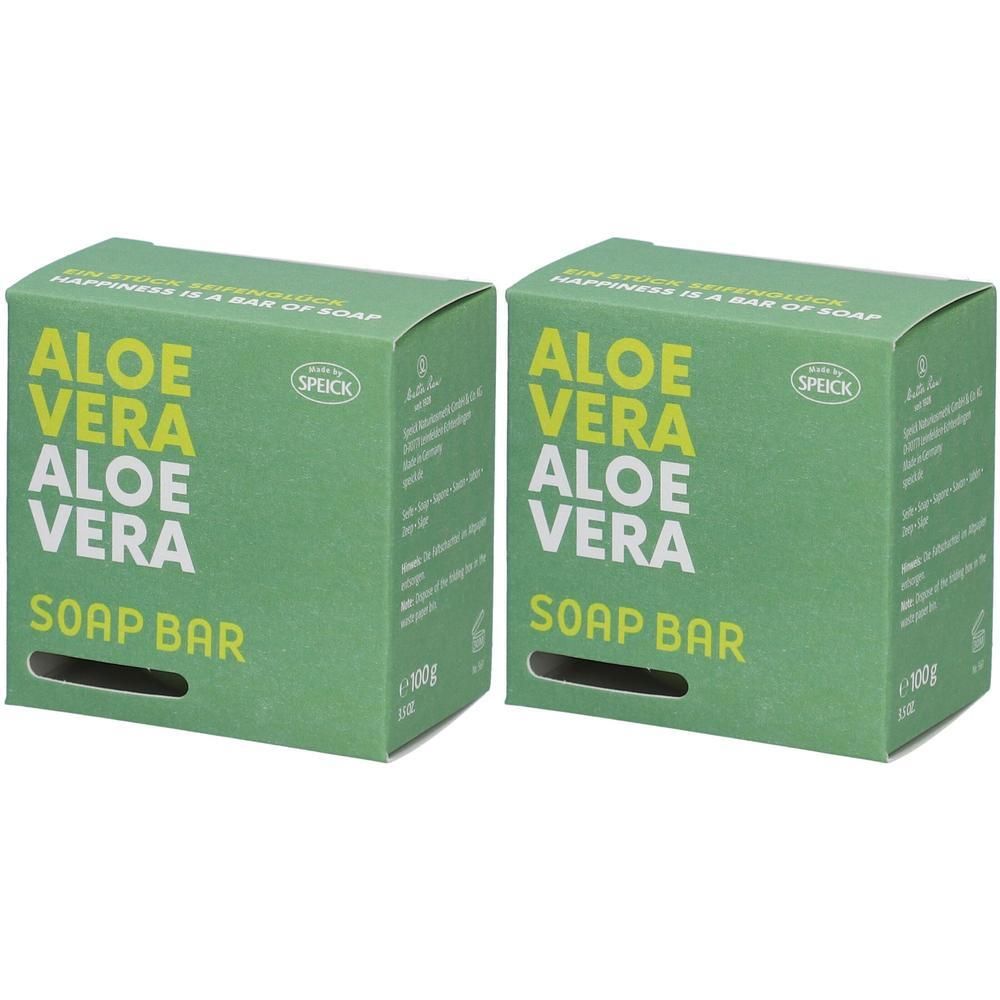 Zwei grüne Kartons mit "ALOE VERA SOAP BAR"-Aufdruck. Marke SPEICK. Aufschrift: "Happiness is a bar of soap".