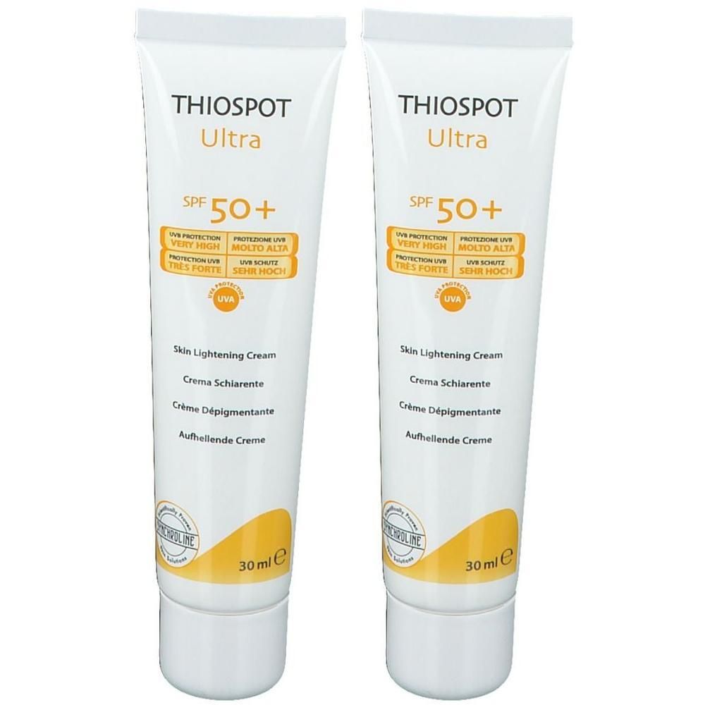 Zwei Tuben Synchroline Thiospot Ultra Creme. Weiße Tuben mit gelben Akzenten und Texten. SPF 50+.