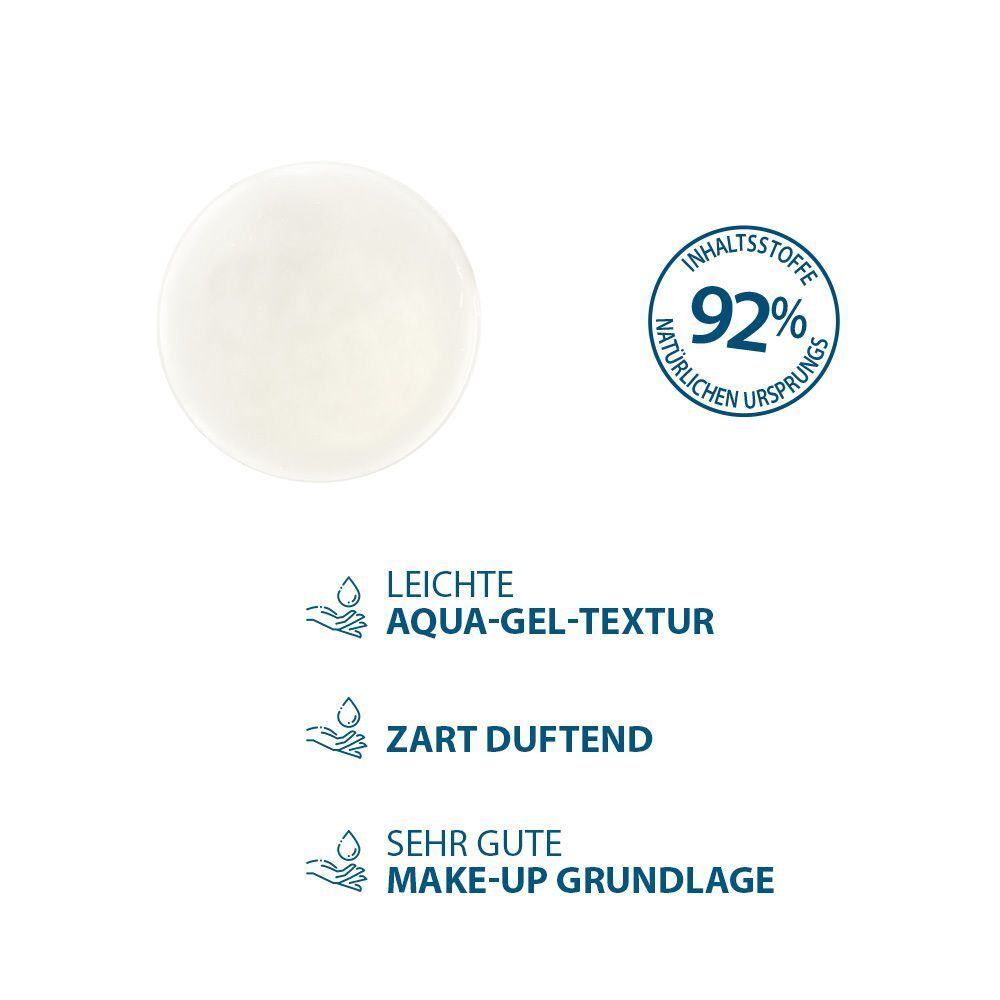 Runde, transparente Flüssigkeit. Text: Leichte Aqua-Gel-Textur, zart duftend, sehr gute Make-up Grundlage. 92% natürlichen Ursprungs.