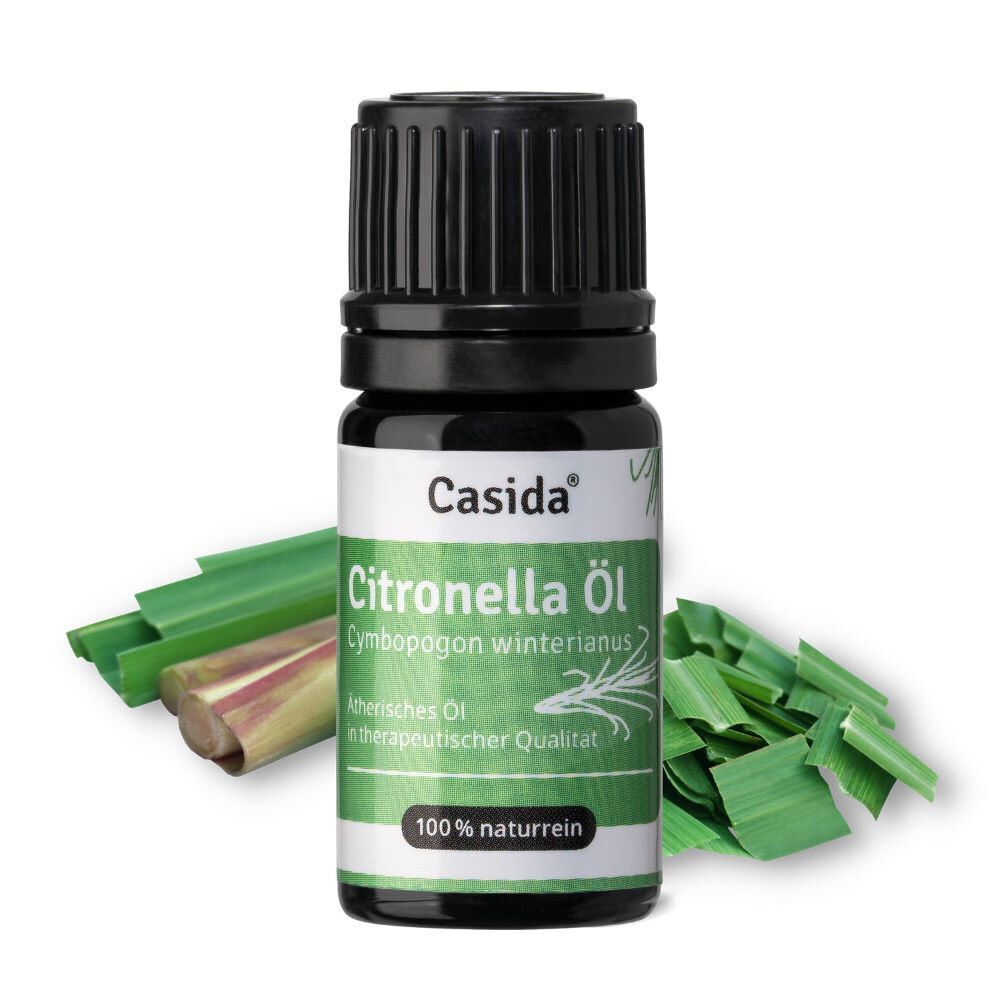 Flasche Citronella Öl mit grünen Blättern. Schwarze Kappe, grünes Etikett. 100% naturrein.