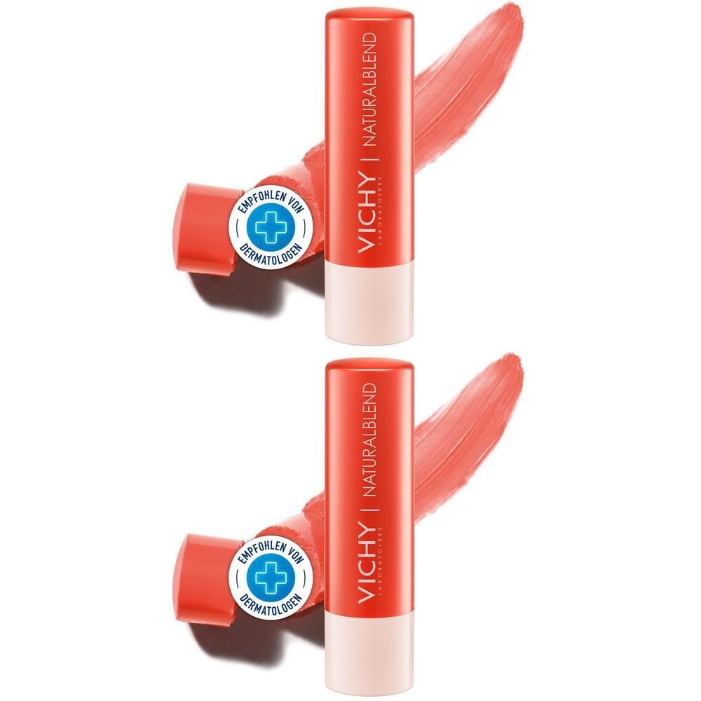 Zwei Lippenbalsam-Stifte in korallenroter Hülle. Aufschrift: VICHY NATURALBLEND. Mit dermatologischer Empfehlung.