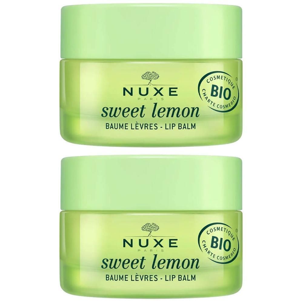 Zwei grüne Tiegel NUXE Sweet Lemon Lippenbalsam. Aufschrift: Sweet Lemon, Baume Lèvres - Lip Balm. Bio-Zertifizierung.