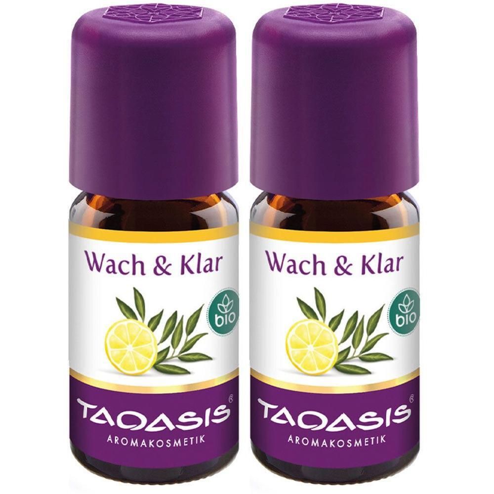 Zwei Flaschen mit lila Deckel. Auf Etiketten: "Wach & Klar", Zitrone, Blätter, "bio"-Siegel, und "TAOASIS Aromakosmetik".