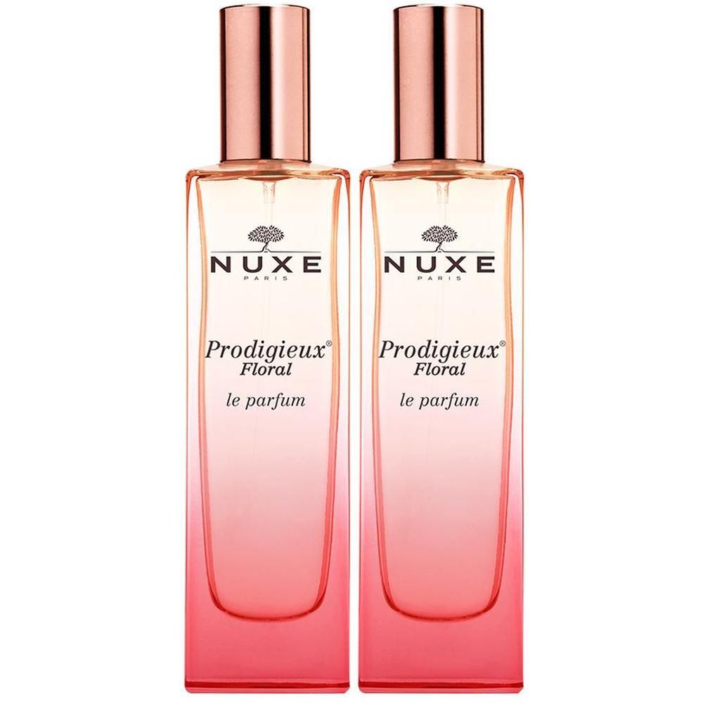 Zwei Flakons NUXE Prodigieux Floral Parfum Spray. Rechteckige Glasflaschen mit rosafarbenem Farbverlauf und kupferfarbenen Verschlüssen.