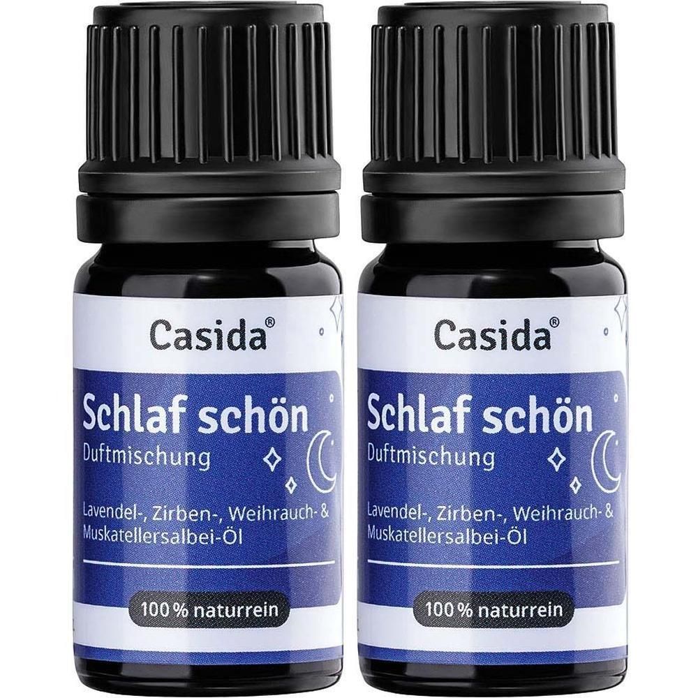 Zwei Flaschen Casida® Schlaf schön Duftmischung. Blaue Etiketten mit Text. Schwarze Deckel. 100% naturrein.