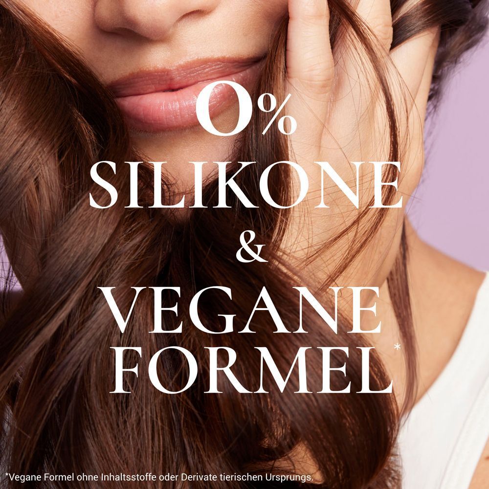 Nahaufnahme einer Person mit Haaren. Text: 0% SILIKONE & VEGANE FORMEL.
