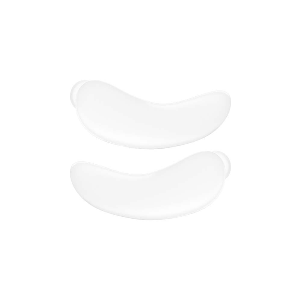 Zwei transparente, halbmondförmige Augenpads. Sie sind aus einem weichen Material gefertigt.