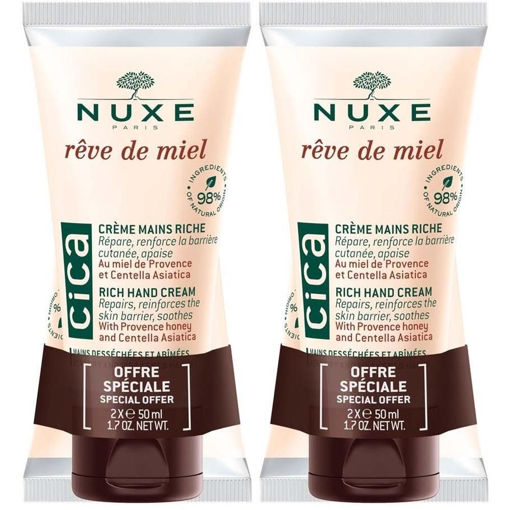 Zwei Tuben Handcreme. Beige Tuben mit braunen Verschlüssen. Aufdruck: Nuxe, Rêve de Miel, Cica, Creme Mains Riche. Angebot: 2x50 ml.