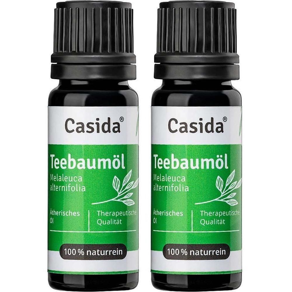 Zwei Flaschen Casida® Teebaumöl. Schwarze Kappen, grüne Etiketten mit Produktinformationen und Logo. 100% naturrein.