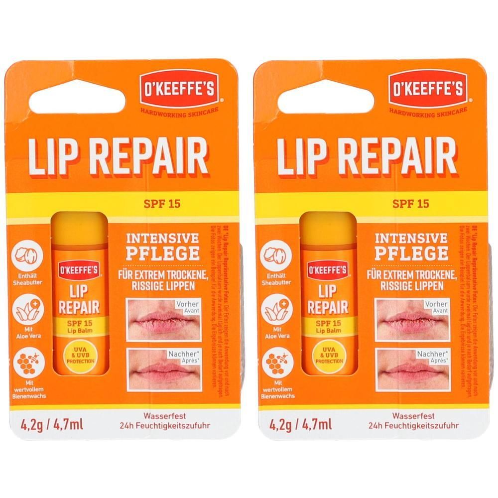 Zwei Packungen O'Keeffe's Lip Repair Lippenpflege. Orangefarbene Verpackung mit Produktname, SPF 15 und Abbildungen von Lippen.
