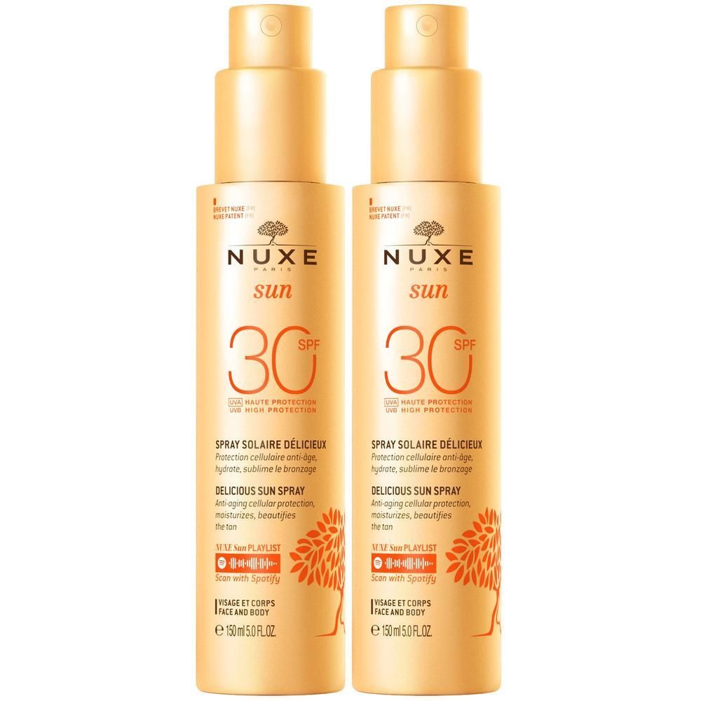 Zwei Sonnensprays. Gelbe Flaschen mit Sprühkopf. Aufschrift NUXE Sun, SPF 30. Text: Delicious Sun Spray.