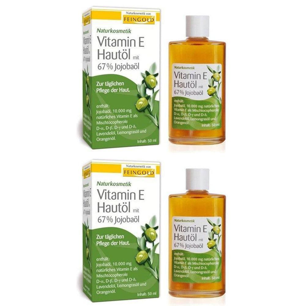 Zwei Flaschen und zwei Kartons. Aufschrift: Vitamin E Hautöl mit 67% Jojobaöl. Naturkosmetik. Zur täglichen Pflege der Haut.