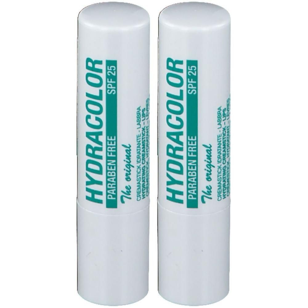 Zwei weiße Lippenpflegestifte mit grüner Beschriftung. Aufschrift: HYDRACOLOR, SPF 25, Paraben Free.