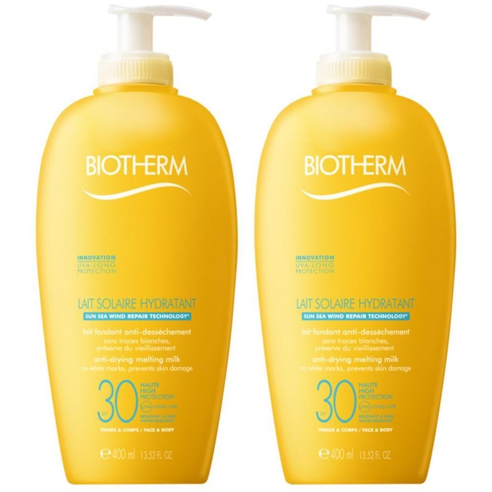 Zwei gelbe Flaschen mit weißem Pumpverschluss. Aufschrift: BIOTHERM, Lait Solaire Hydratant LSF 30. E400ml.