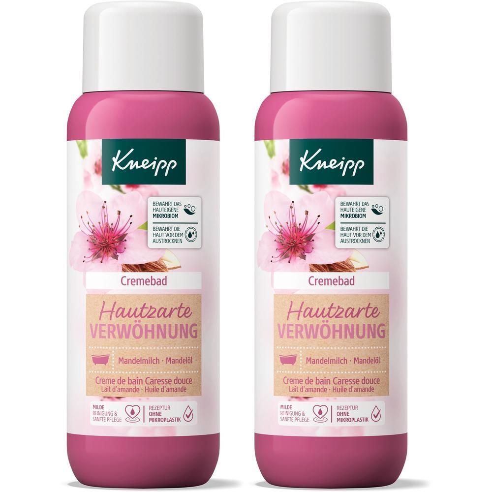 Zwei Flaschen Cremebad. Rosa Flaschen mit weißem Deckel. Aufdruck: Kneipp, Cremebad Hautzarte Verwöhnung, Mandelmilch, Blüten.