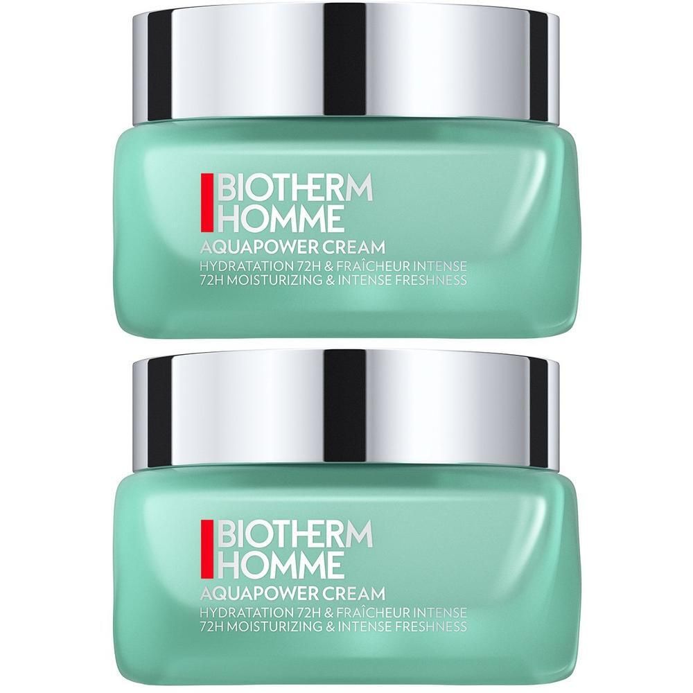 Zwei quadratische Tiegel BIOTHERM HOMME AQUAPOWER CREAM. Türkisgrüne Creme in Glasbehältern mit silbernen Deckeln. Text auf den Behältern.