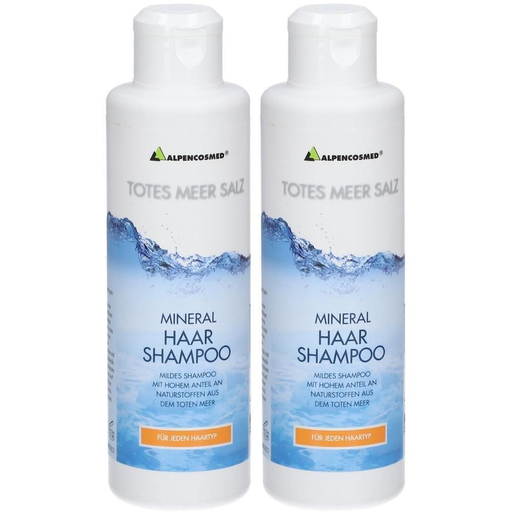 Zwei weiße Flaschen mit Shampoo. Aufschrift: Totes Meer Salz, Mineral Haar Shampoo. Marke: ALPENCOSMED. Für jeden Haartyp.