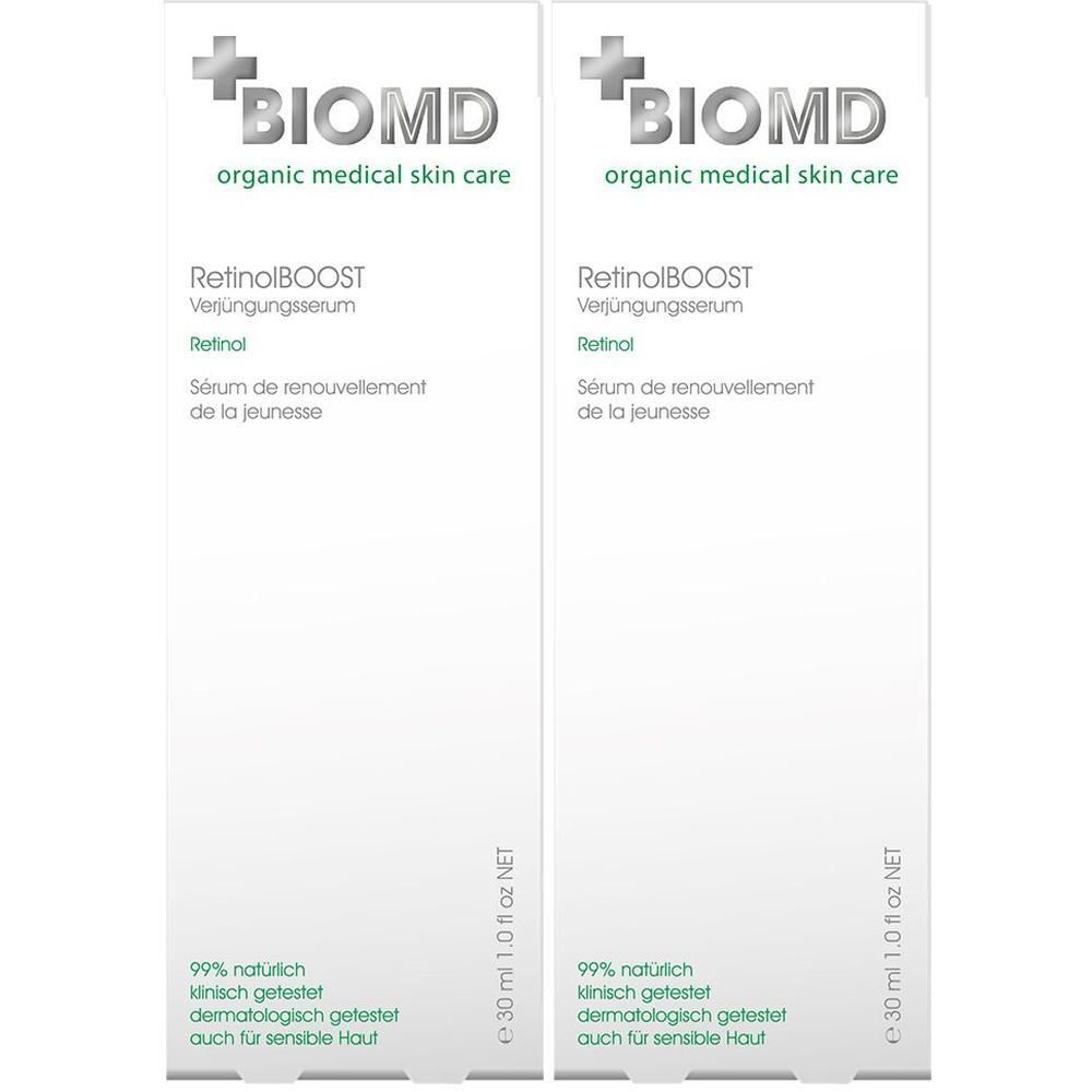 Zwei weiße Faltschachteln. Aufdruck: BIOMD, Retinol BOOST Verjüngungsserum, 99% natürlich, dermatologisch getestet. 30 ml.