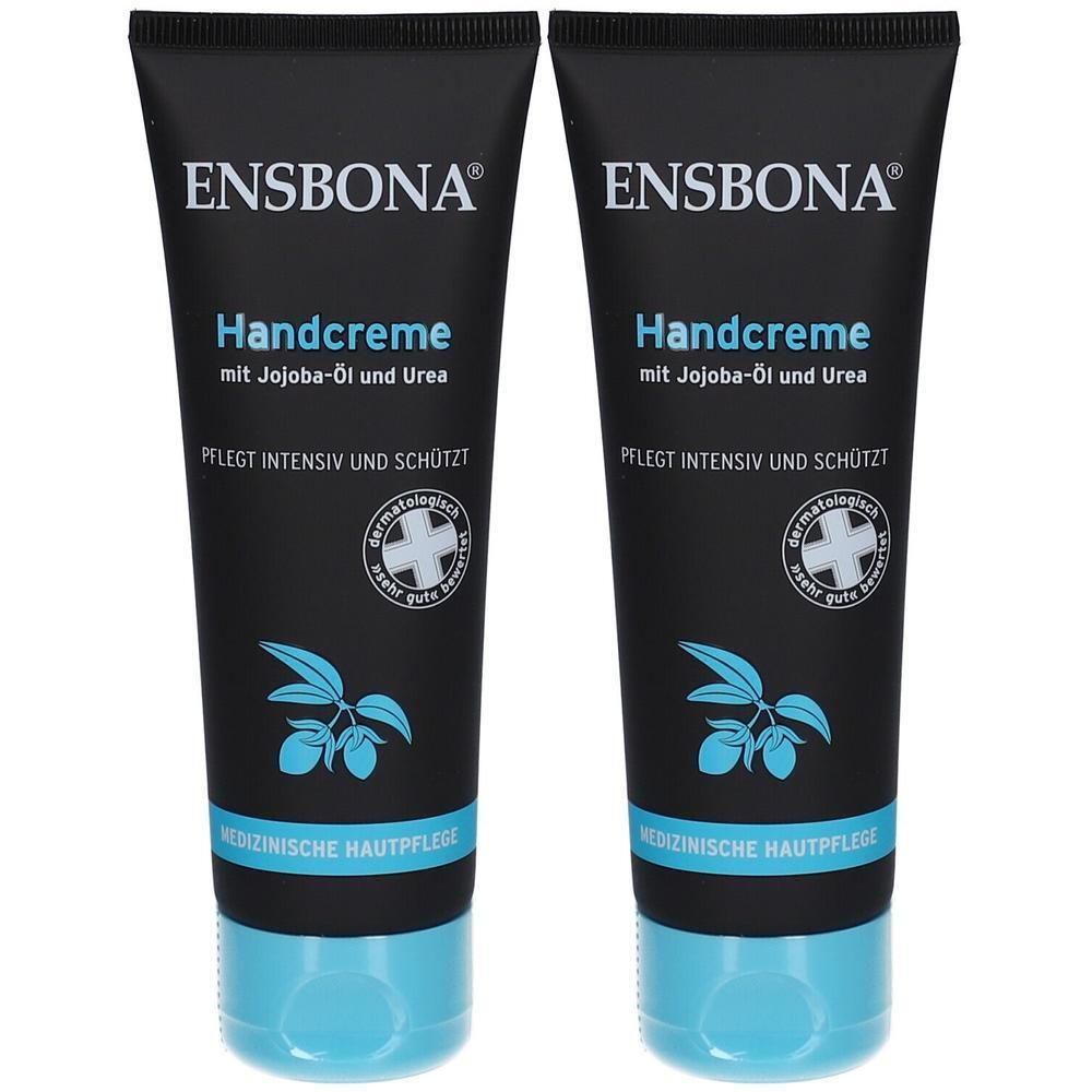 Zwei schwarze Tuben Ensbona Handcreme mit Jojobaöl und Urea. Blaue Kappe und blaue Blättergrafik.