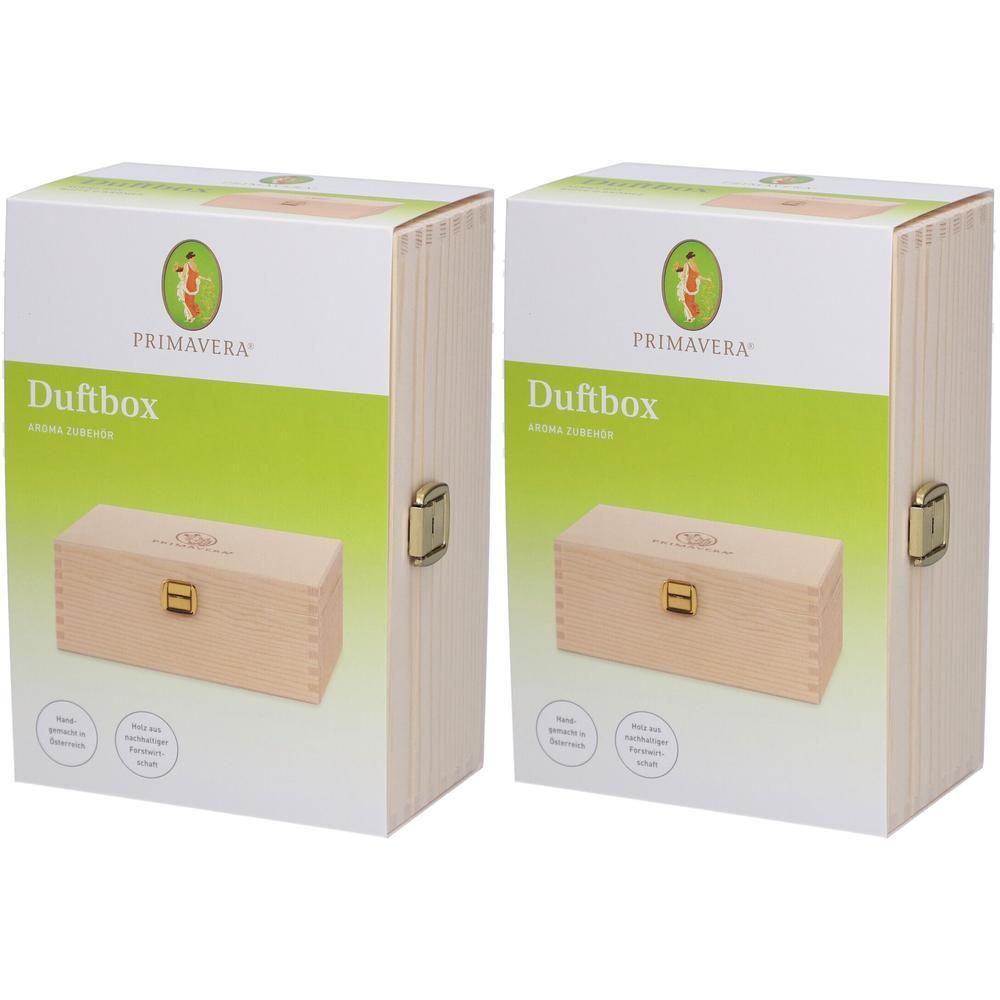 Zwei PRIMAVERA Duftboxen in Verpackung. Rechteckige Holzboxen mit goldfarbenem Verschluss. Aufschrift: Duftbox, PRIMAVERA.