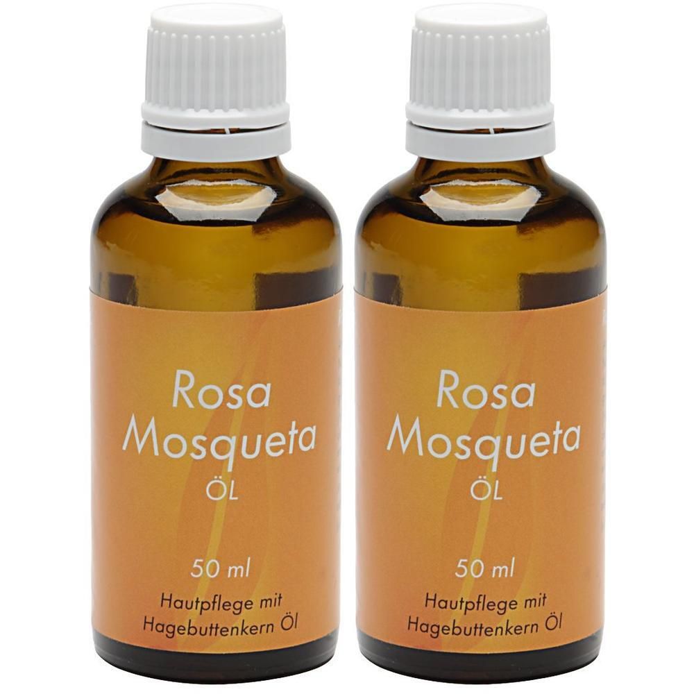 Zwei braune Glasflaschen mit weißem Deckel. Aufschrift: Rosa Mosqueta Öl, 50 ml. Hautpflege mit Hagebuttenkern Öl.