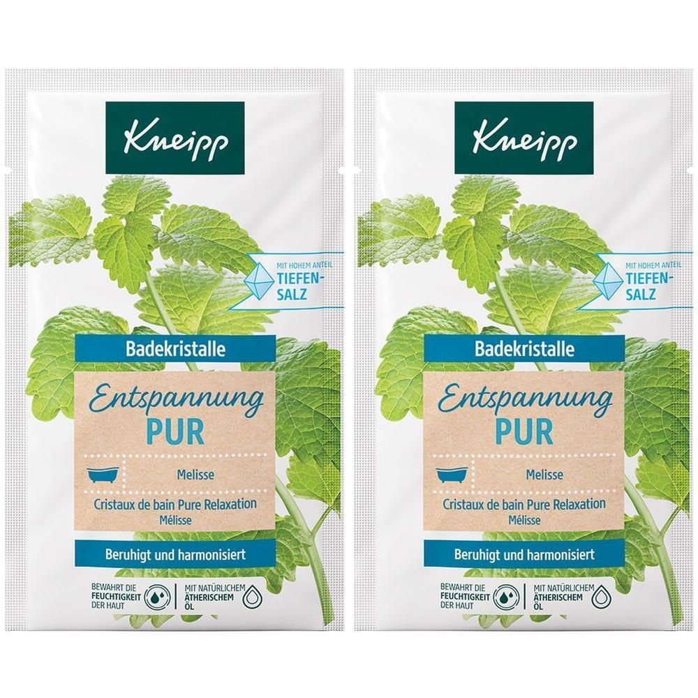 Zwei Beutel KNEIPP Badekristalle Entspannung Pur. Grün-weiße Verpackung mit Kräutern und Produktinformationen.