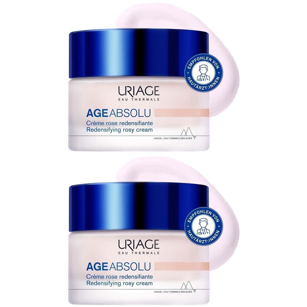 Zwei Tiegel Uriage Age Absolu Rosé-Creme. Blaue Deckel, rosa Creme. Aufschrift: AGE ABSOLU, Crème rose redensifiante.
