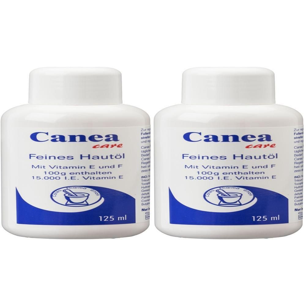 Zwei weiße Flaschen CANEA Hautöl. Aufschrift: Feines Hautöl, Vitamin E und F, 125 ml. Blaue und weiße Etiketten mit Logo.
