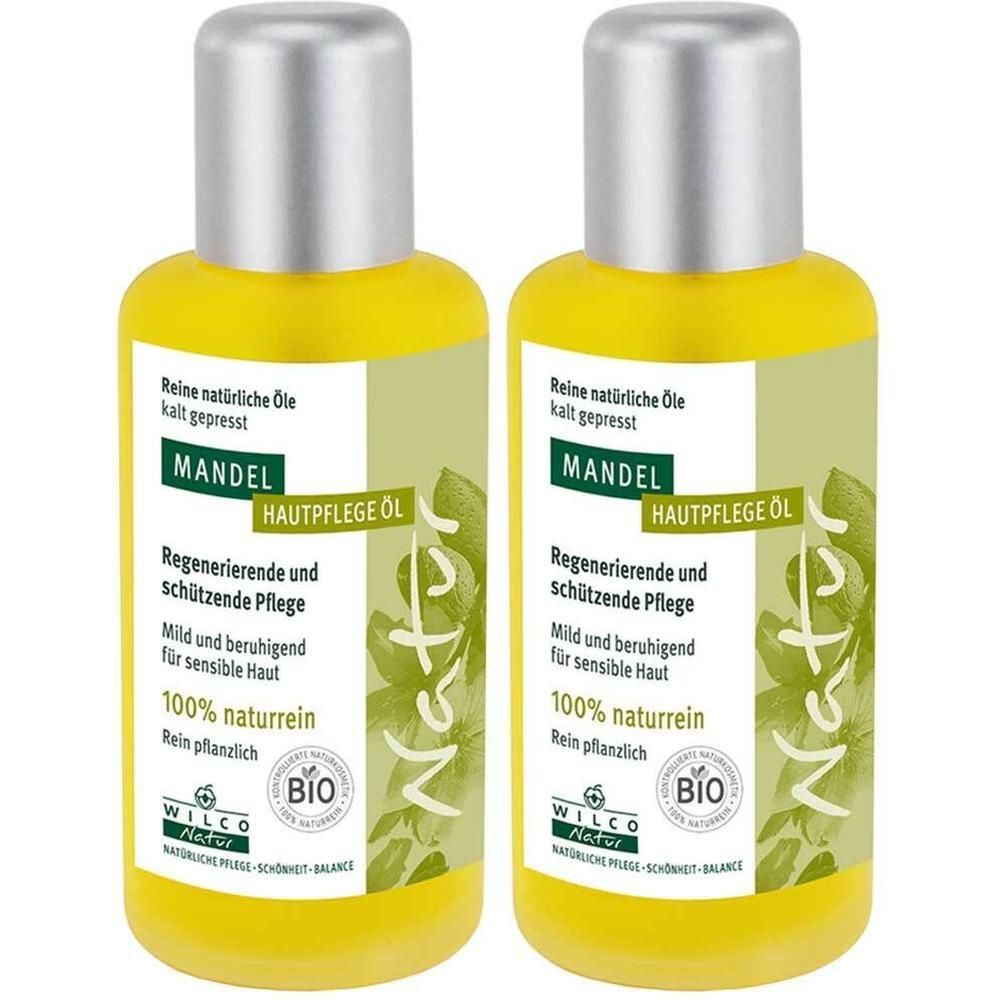 Zwei gelbe Flaschen mit silbernen Deckeln. Aufschrift: Mandel Hautpflege Öl, 100% naturrein, Bio-Siegel. Marke: Wilco Natur.