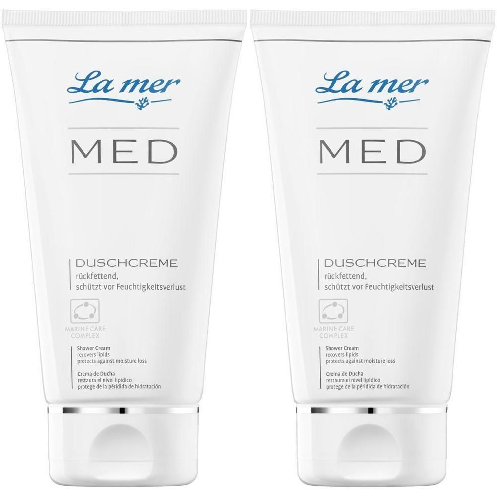 Zwei weiße Tuben La mer MED Duschcreme. Aufschrift: MED, DUSCHCREME, schützt vor Feuchtigkeitsverlust. Mit silberner Kappe.